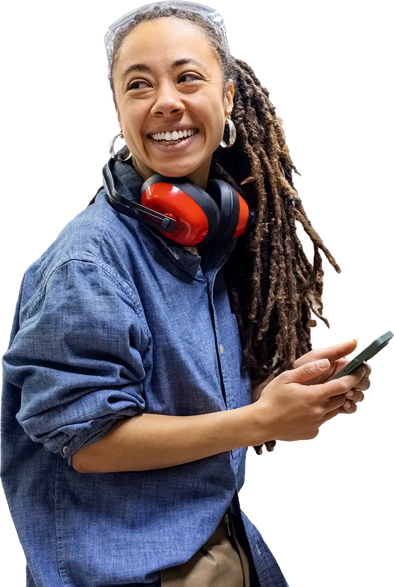 Woman smiling wearing construction hearing protection