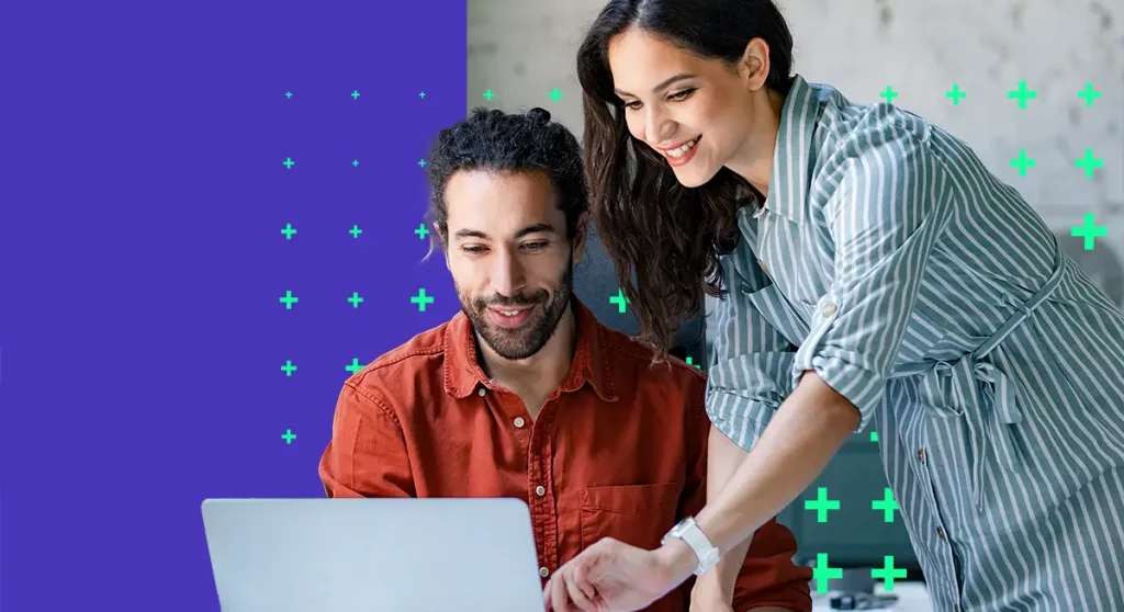 Man and woman working at computer together